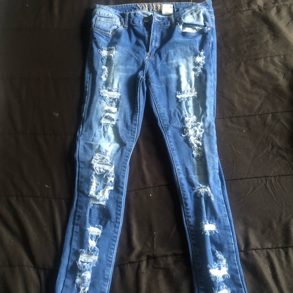 Ripped jeans with contrast stitching.